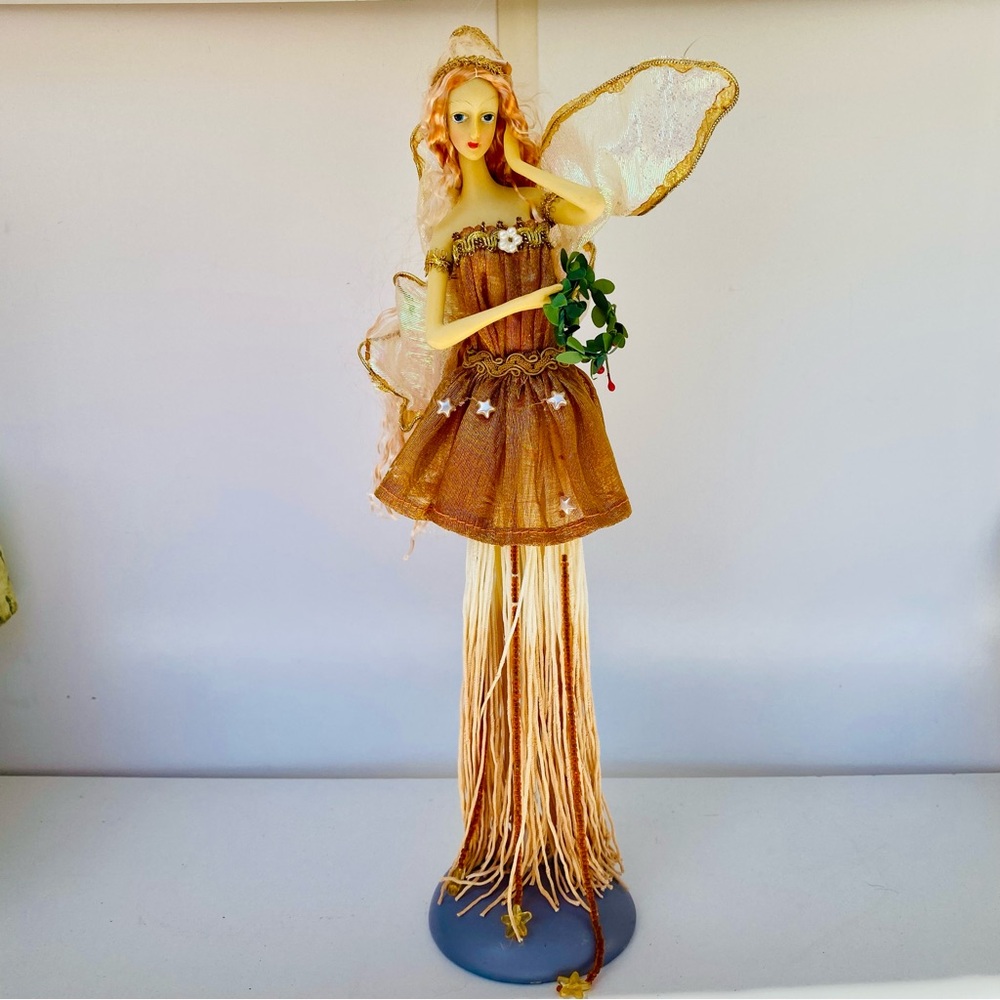 Elegant Fairy Figurine with Gold and Brown Dress